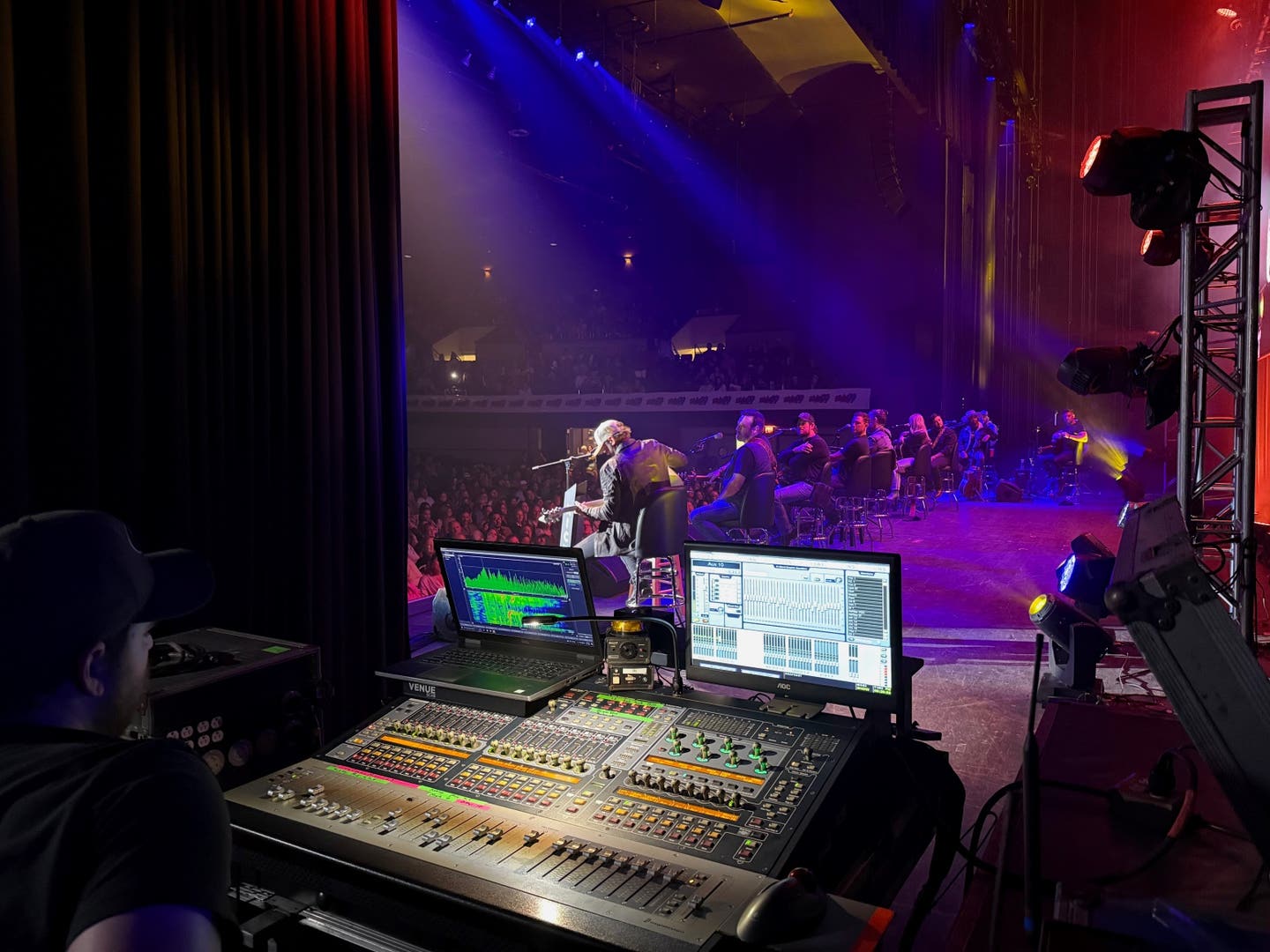 The view from the backstage soundboard as Drew Baldridge performs on the second night of the 2024 KICKS 99 Guitar Pull.