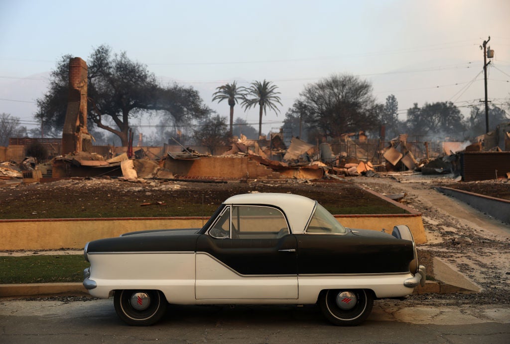 ALTADENA, CALIFORNIA: A vintage Nash Metropolitan sits parked in front of a home that was destroyed by Eaton Fire on January 09, 2025 in Altadena, California. 