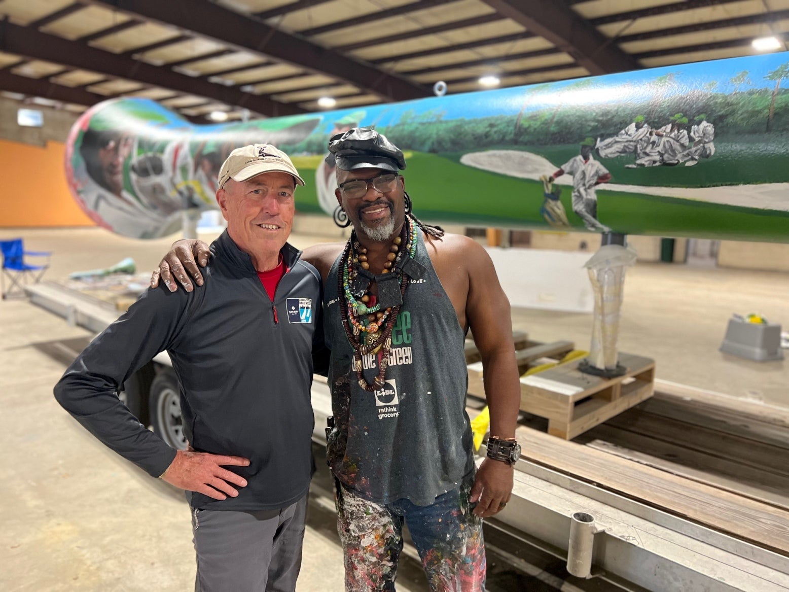 Ed Durant (L) and Baruti Tucker (R) in front of the nearly completed tee sculpture.