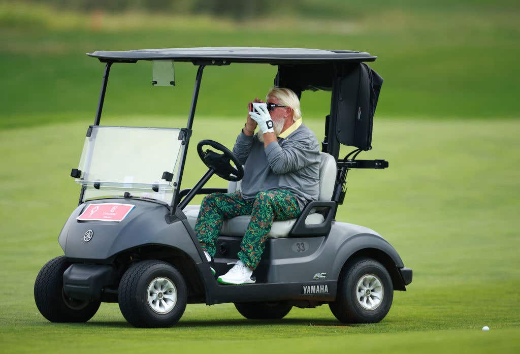 CALGARY, CANADA : John Daly of the United States uses a rangefinder on the 15th fairway during the second round of the Rogers Charity Classic at Canyon Meadows Golf &amp; CC on August 17, 2024 in Calgary, Alberta, Canada.