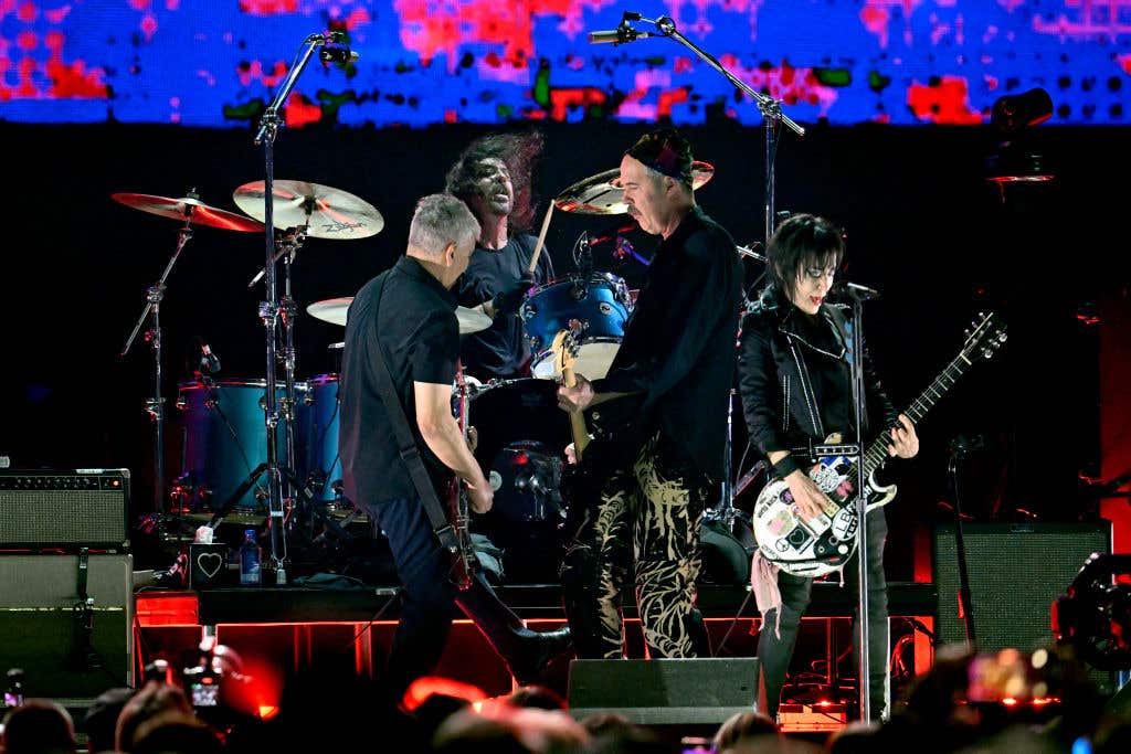 Joan Jett (R) performs onstage with (L-R) Pat Smear, Dave Grohl, and Krist Novoselic of Nirvana during the FIREAID Benefit Concert for California Fire Relief at The Kia Forum on January 30, 2025 in Inglewood, California.