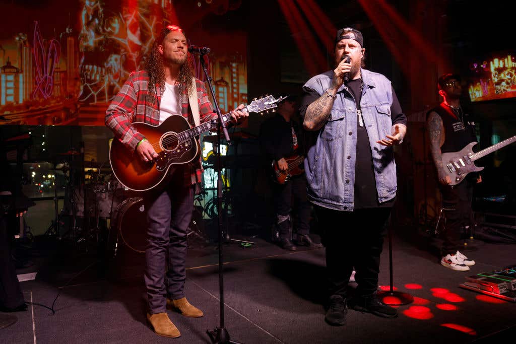 NASHVILLE, TENNESSEE: (L-R) Brandon Lake and Jelly Roll perform onstage for Goodnight Nashville grand opening event at Jelly Roll's Goodnight Nashville on February 20, 2025 in Nashville, Tennessee.