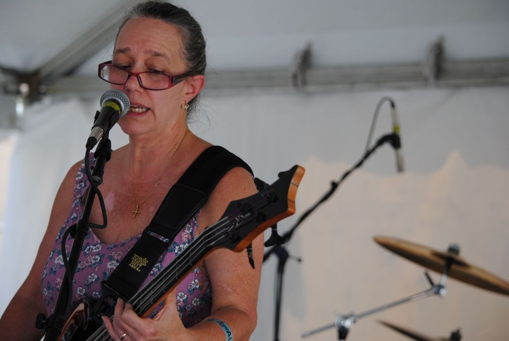 Mindy Stephens performs with Livingroom Legends on the Community Stage at the 2024 Arts In the Heart of Augusta Festival.