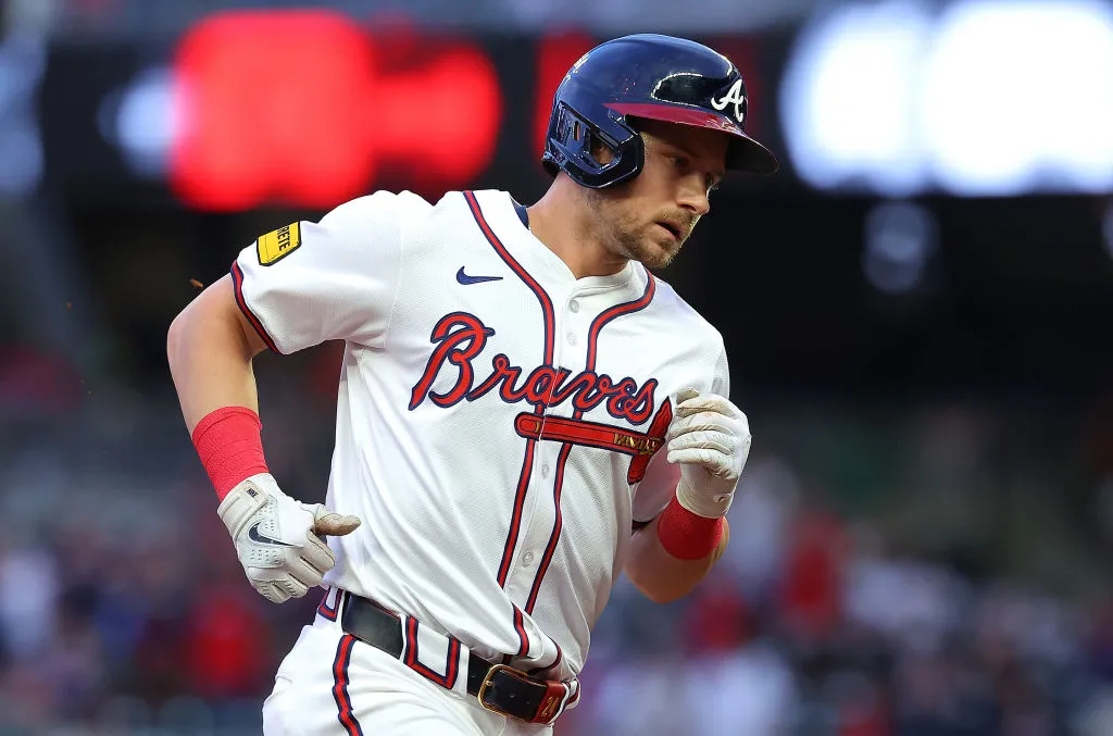 Jarred Kelenic #24 of the Atlanta Braves rounds third base after hitting a three-run homer in the first inning against the Colorado Rockies at Truist Park on September 04, 2024 in Atlanta, Georgia.