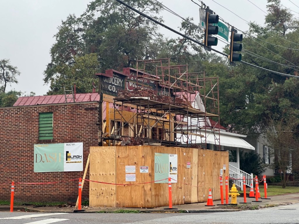 This building on the corner of Central Avenue and Monte Sano is being restored and remodeled. What is uncertain the future of the historic grocery sign uncovered during work on the structure's facade.