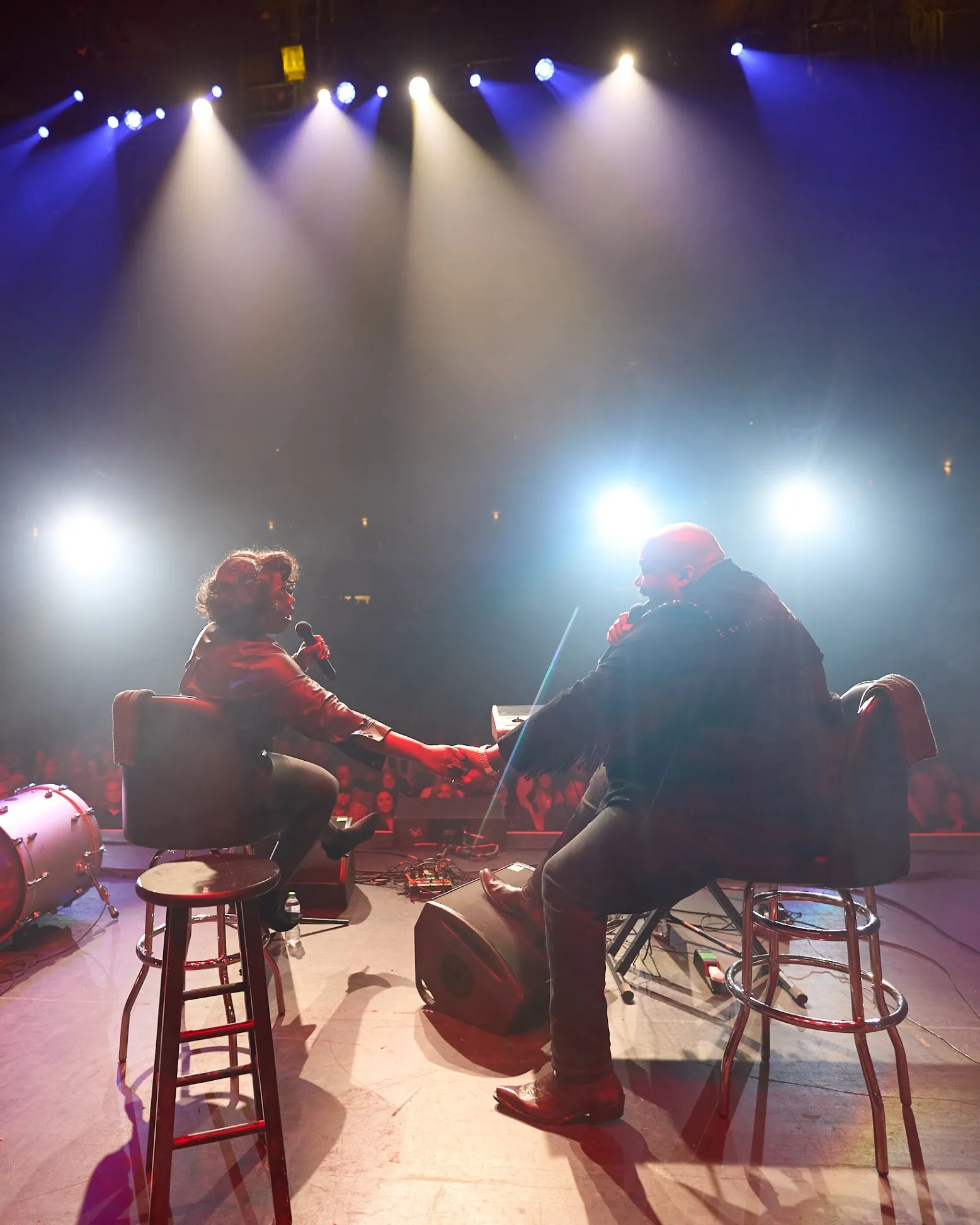 Michael Trotter, Jr. and Tanya Trotter, known professionally as the War & Treaty, show a not-uncommon moment of affection during their performance at the 2024 Guitar Pull Concert at Bell Auditorium.